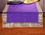 Regal purple silk table runner running down a dining table