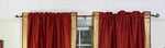 Rust sari rod pocket curtains hung at a window