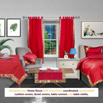 Maroon sari tab top curtains hung at a window