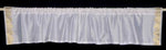 White sari valance mounted above a window