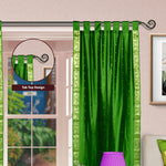 Forest green sari tab top curtains hung at a window