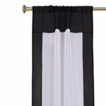 Black sheer tissue rod pocket curtains hung at a window