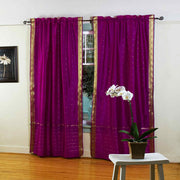 Violet sari rod pocket curtains hung at a window