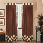 Brown sari tab top curtains hung at a window