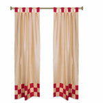Gold sari tab top curtains hung at a window