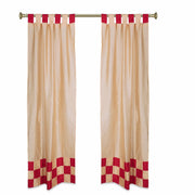 Gold sari tab top curtains hung at a window