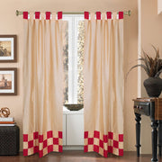 Gold sari tab top curtains hung at a window