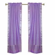 Lavender sari rod pocket curtains hung at a window