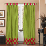 Olive green sari tab top curtains hung at a window