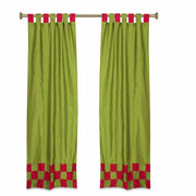 Olive green sari tab top curtains hung at a window