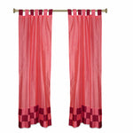Peach sari tab top curtains hung at a window