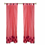 Peach sari tab top curtains hung at a window