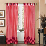 Peach sari tab top curtains hung at a window