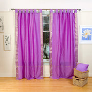 Lavender sari tab top curtains hung at a window