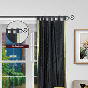 Black sari tab top curtains hung at a window