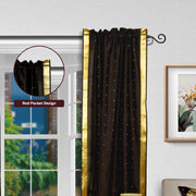 Black sari rod pocket curtains hung at a window