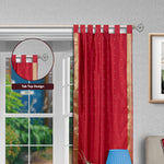 Fire brick sari tab top curtains hung at a window