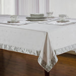 Silver sari tablecloth laid on a dining table