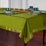 Olive green sari tablecloth laid on a dining table