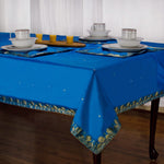Cool blue sari tablecloth laid on a dining table