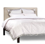 Silver sari duvet cover set made up on a bed
