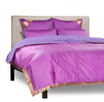 Lavender sari duvet cover set made up on a bed