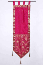 Pink sari wall hanging displayed on a wall