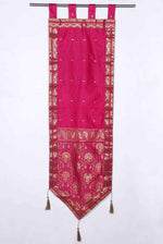 Pink sari wall hanging displayed on a wall