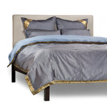 Gray sari duvet cover set made up on a bed