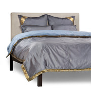 Gray sari duvet cover set made up on a bed
