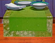 Forest green silk table runner running down a dining table