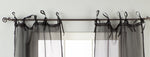 Sheer tissue tie top curtains hung at a window