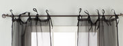 Sheer tissue tie top curtains hung at a window