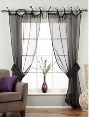 Sheer tissue tie top curtains hung at a window