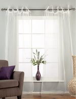 Sheer tissue tie top curtains hung at a window