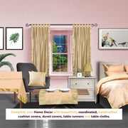 Golden sari tab top curtains hung at a window