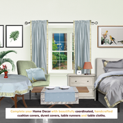 Gray sari rod pocket curtains hung at a window