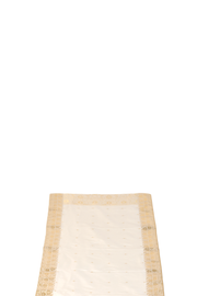 Cream silk table runner running down a dining table