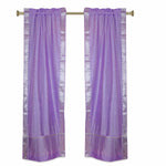 Lavender sari rod pocket curtains hung at a window
