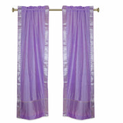 Lavender sari rod pocket curtains hung at a window
