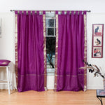 Violet sari tab top curtains hung at a window