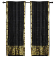 Black sari rod pocket curtains hung at a window