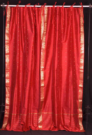 Fire brick sari tie top curtains hung at a window