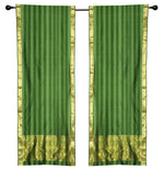 Green sari rod pocket curtains hung at a window