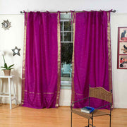 Violet sari tie top curtains hung at a window