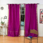 Violet sari tie top curtains hung at a window