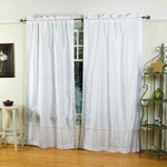 Silver sari rod pocket curtains hung at a window
