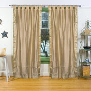 Golden sari tab top curtains hung at a window