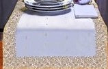 White silk table runner running down a dining table