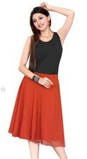 Orange georgette pleated skirt shown draped on a model